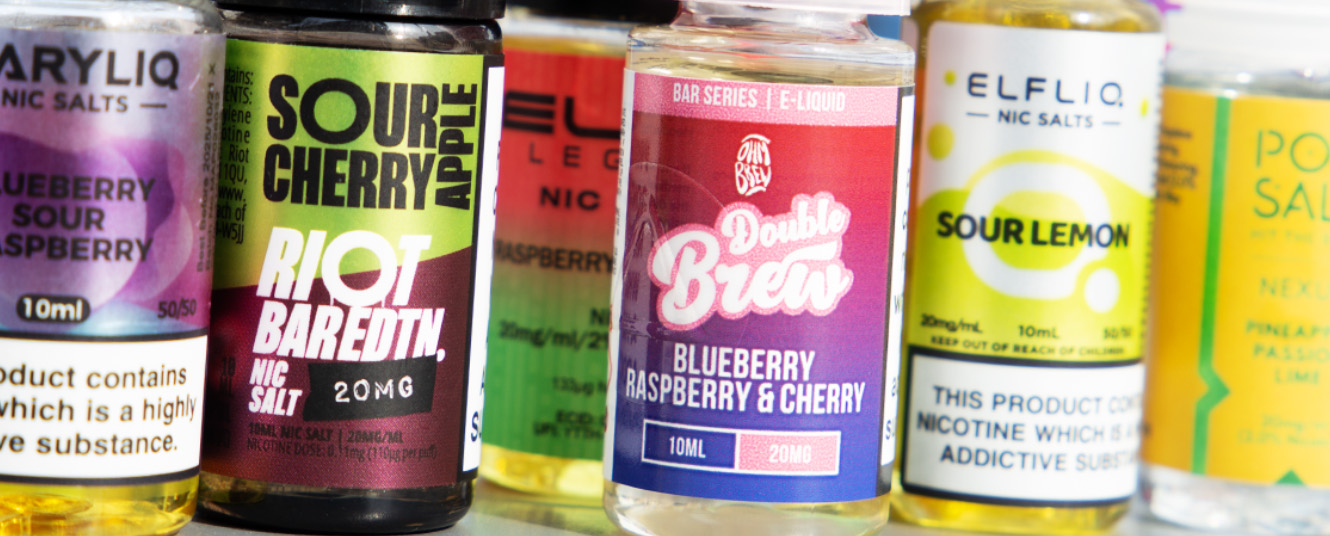 A range of e-liquid bottles from various brands